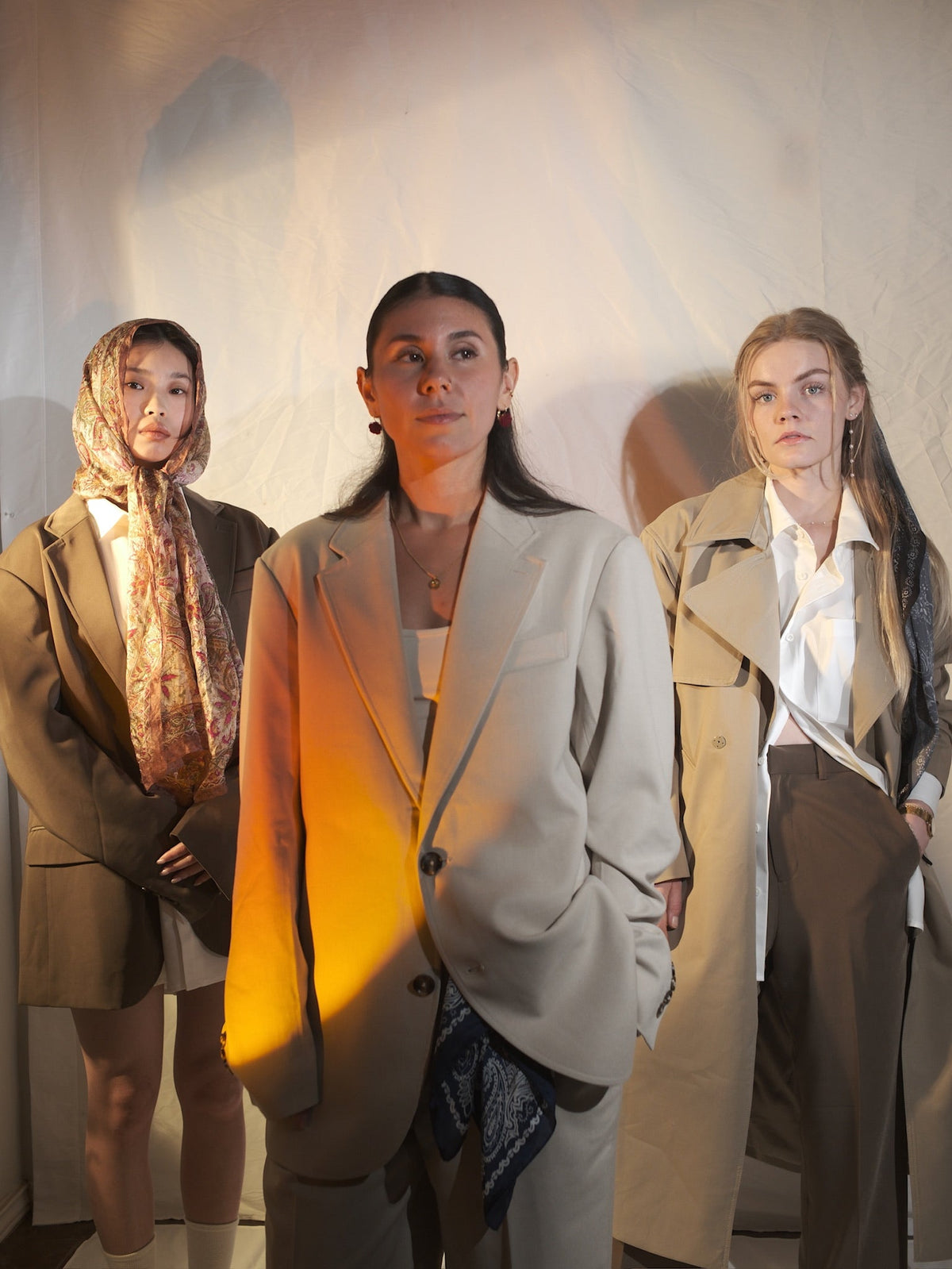 Three women wearing layered ARVOpm tailoring for Texas in Two Voices